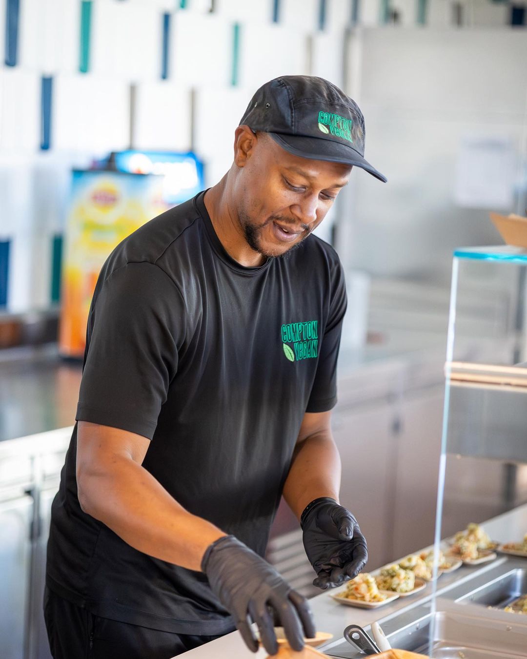 Photo of person in hat making food.