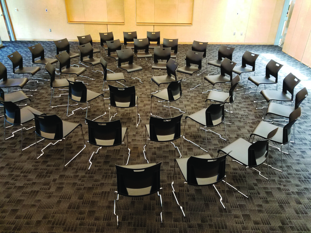 A circle of chairs awaits participants in an upcoming group relations activity designed to ease anxiety and foster connection in large group settings. This year’s theme invites participants to explore how queer and gender-expansive identities can reshape leadership, authority, and group dynamics.