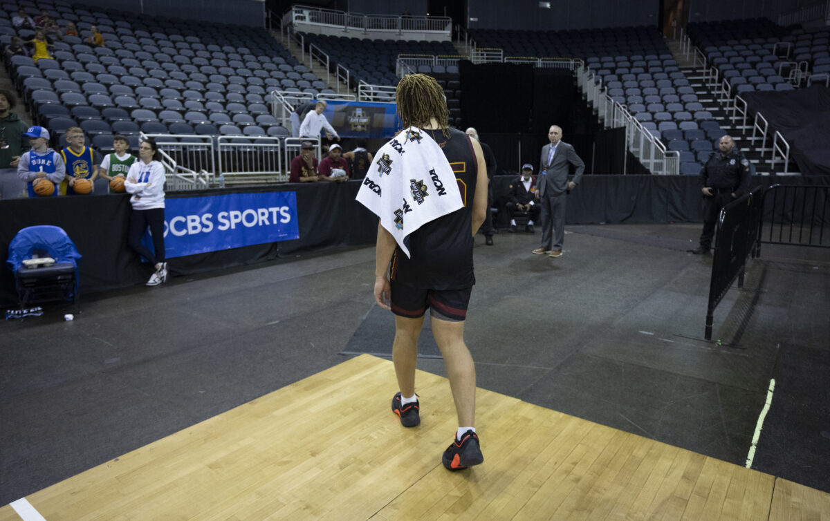 Toro men's basketball player walks away toward the locker room after a game.
